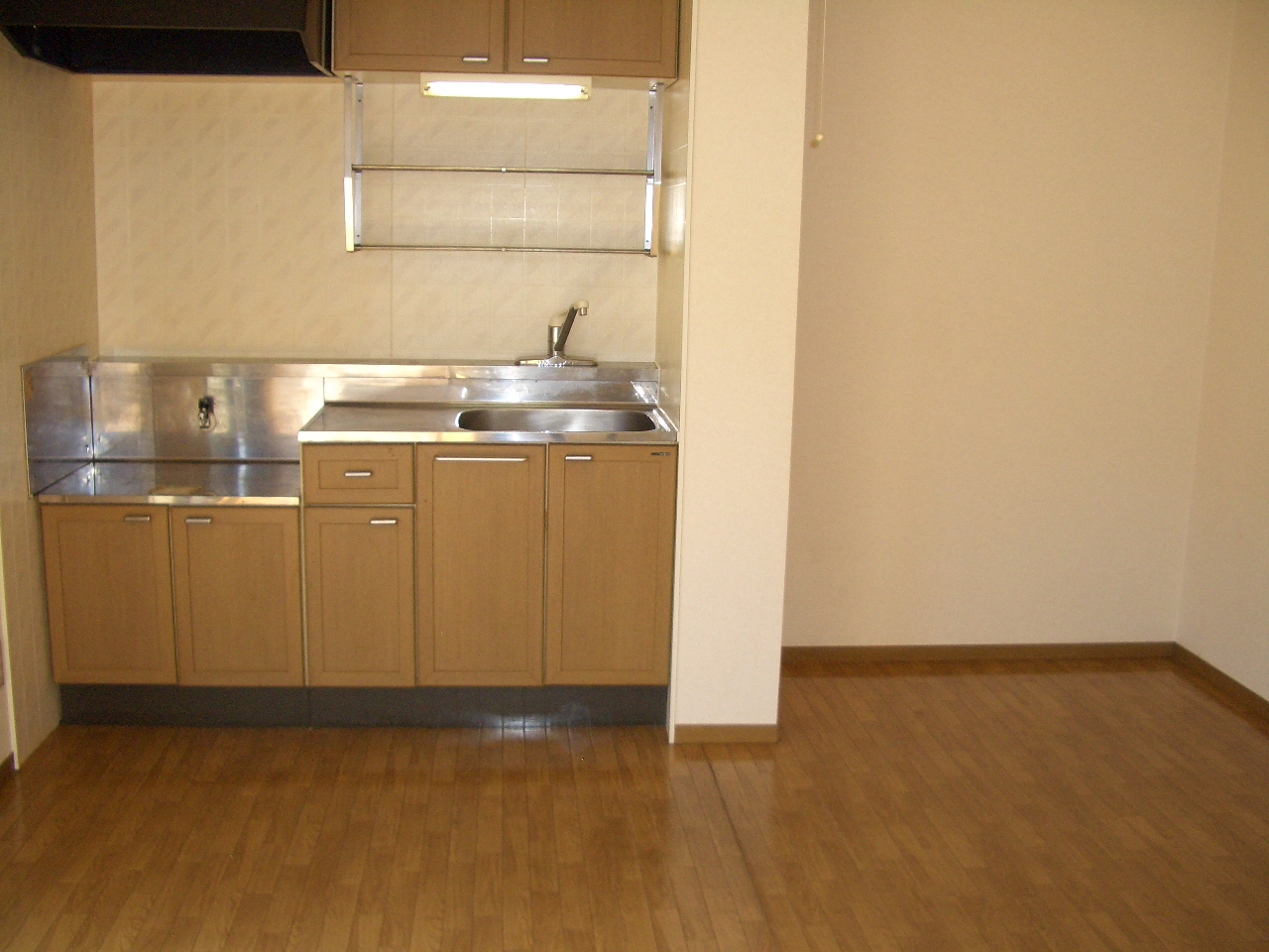 Kitchen. There is space to put a refrigerator or cupboard on the right-hand side. 