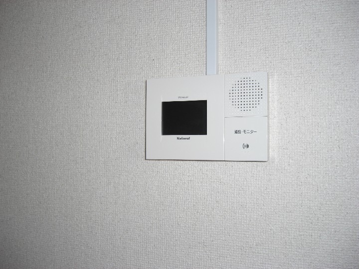 Security. Monitor with intercom of relieved to see the face of the visitor