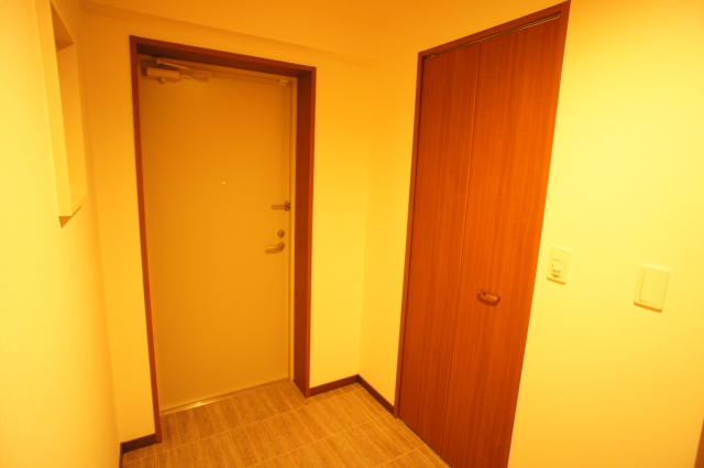 Entrance. Large shoes with cloak