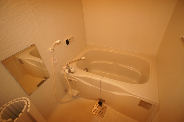 Bath. Bathroom with reheating hot water supply