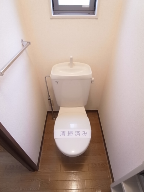 Toilet. With ventilation window in the toilet! Also towel or paper holder