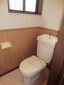 Toilet. It has a small window