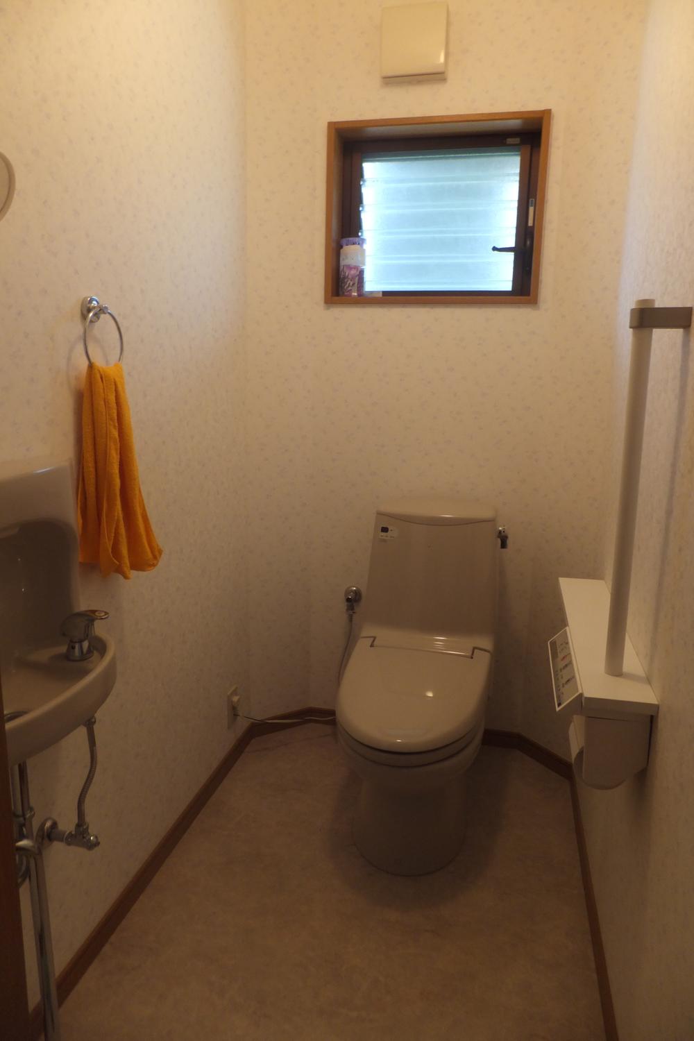 Toilet. First floor toilet: Hand wash ・ Handrail with storage