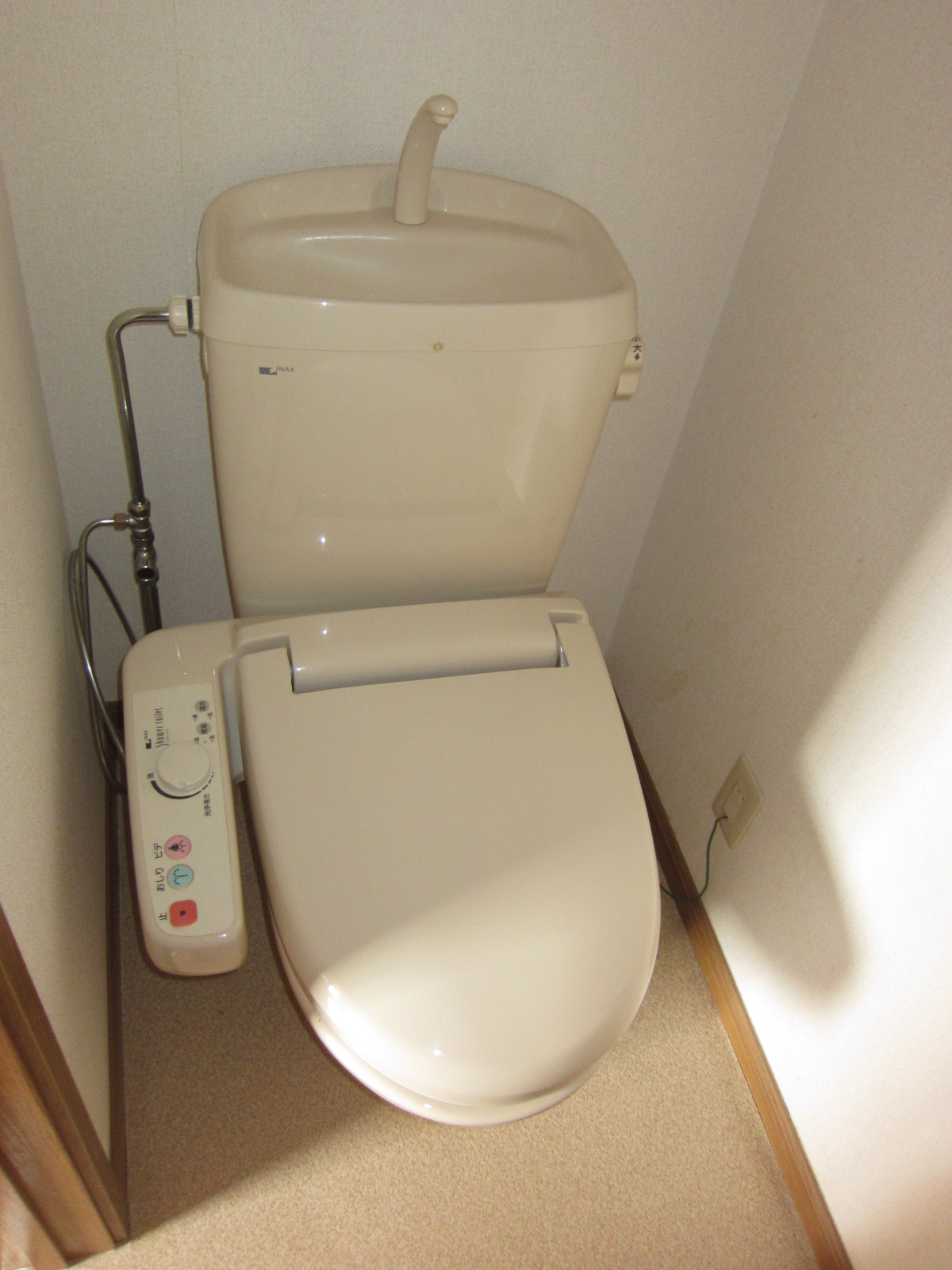 Toilet. It is a photograph of another room.