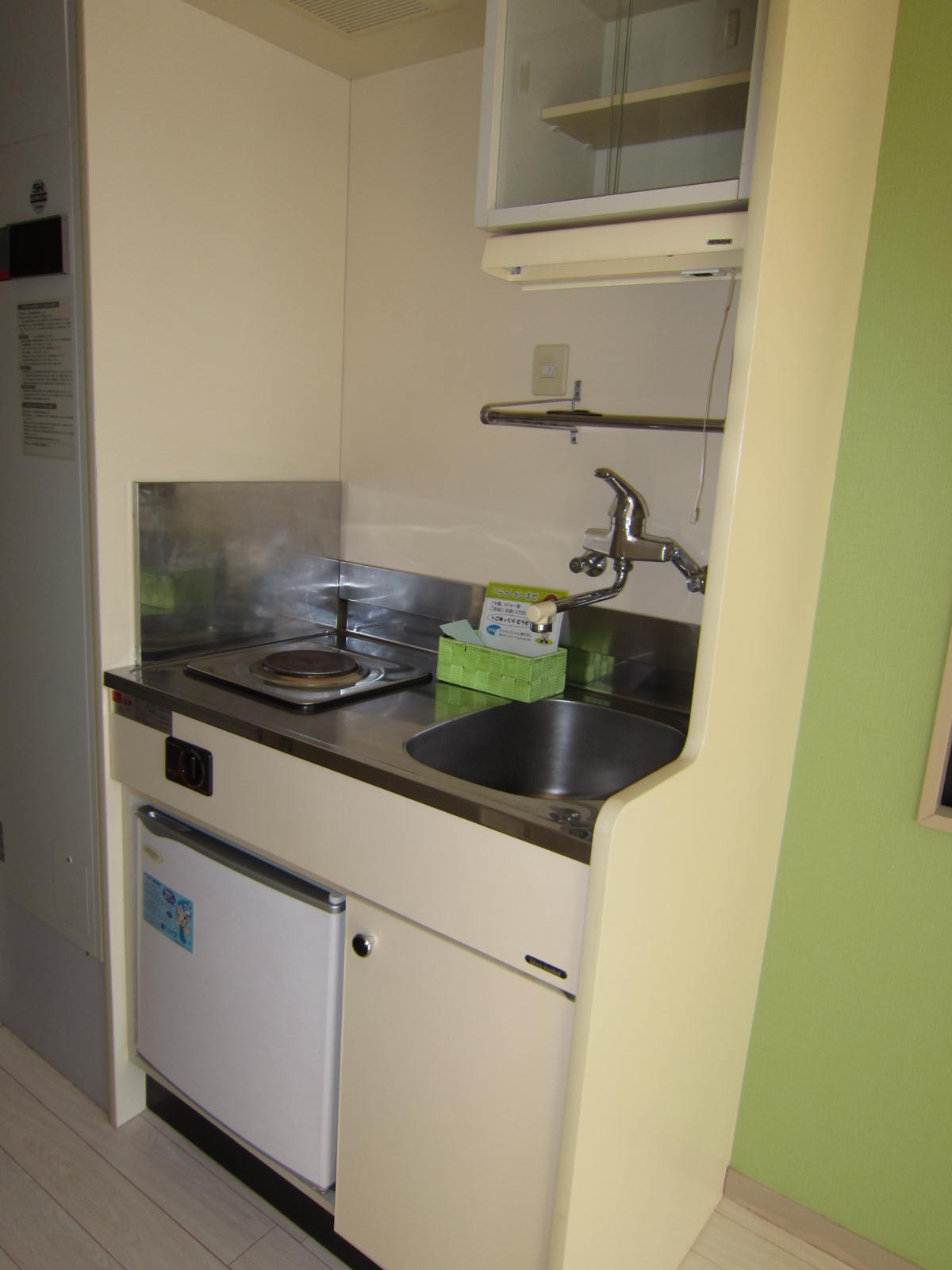 Kitchen. Electric stove ・ With a mini fridge