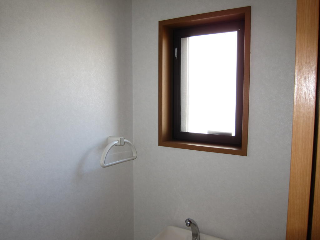 Toilet. The toilet is equipped with a window