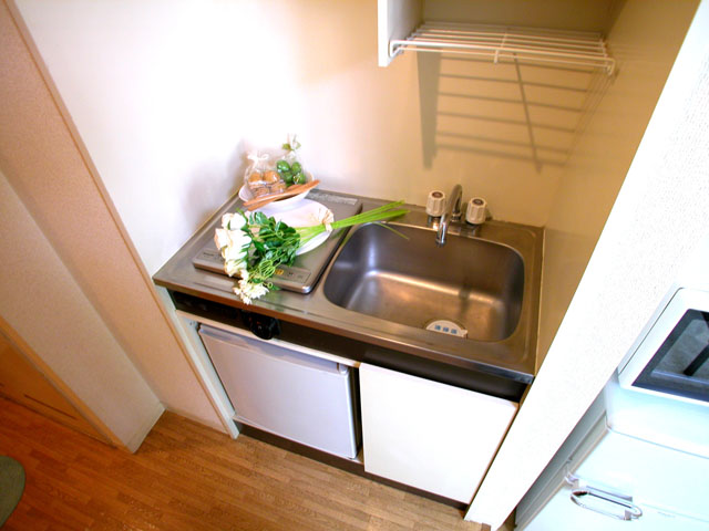 Kitchen. It is a photograph of the 1-E, Room.