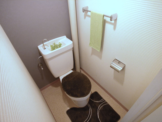 Toilet. It is a photograph of the 1-E, Room.