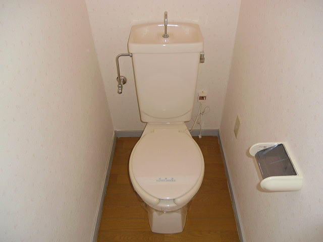 Toilet. Since the outlet is attached, It can be mounted, such as warm water washing toilet seat.