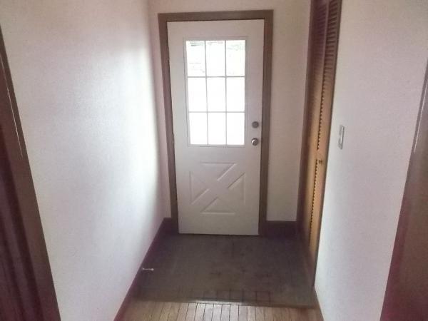 Entrance. There are shoes space is on the right