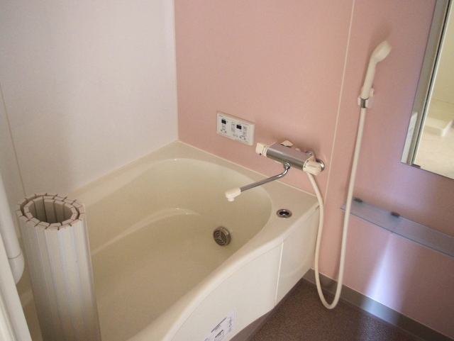 Bath. The photograph is a separate, Room