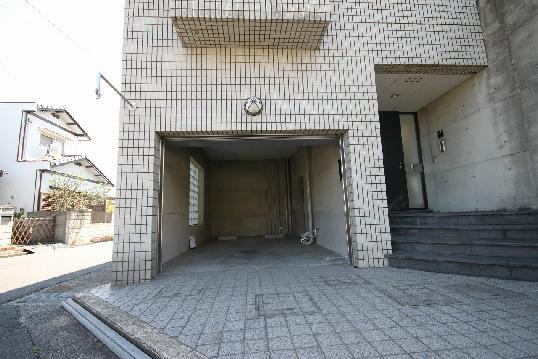 Parking lot. Built-in garage is equipped with electric shutter