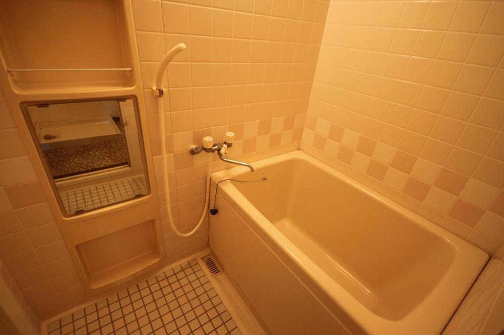 Bathroom. A feeling of cleanliness is a tiled bathroom.