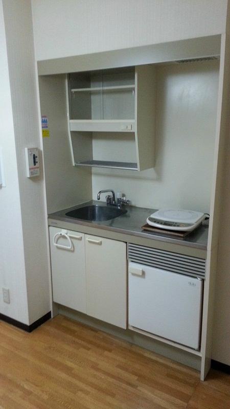 Kitchen. It is a kitchen with a refrigerator