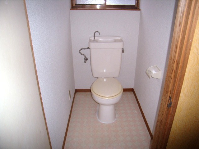 Toilet. It is a photograph of the same type by the room