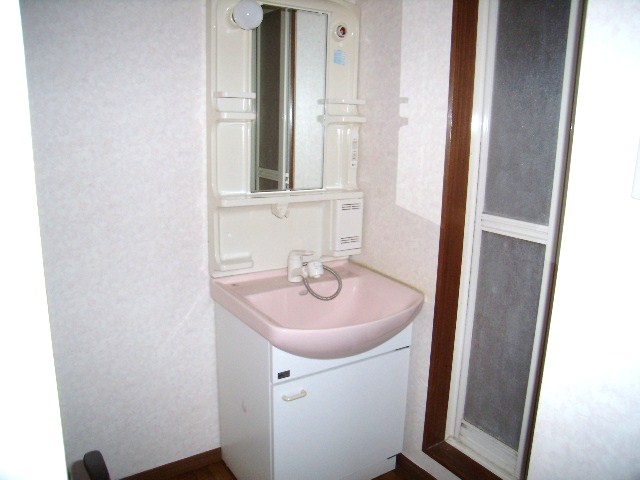 Washroom. It is a photograph of the same type by the room