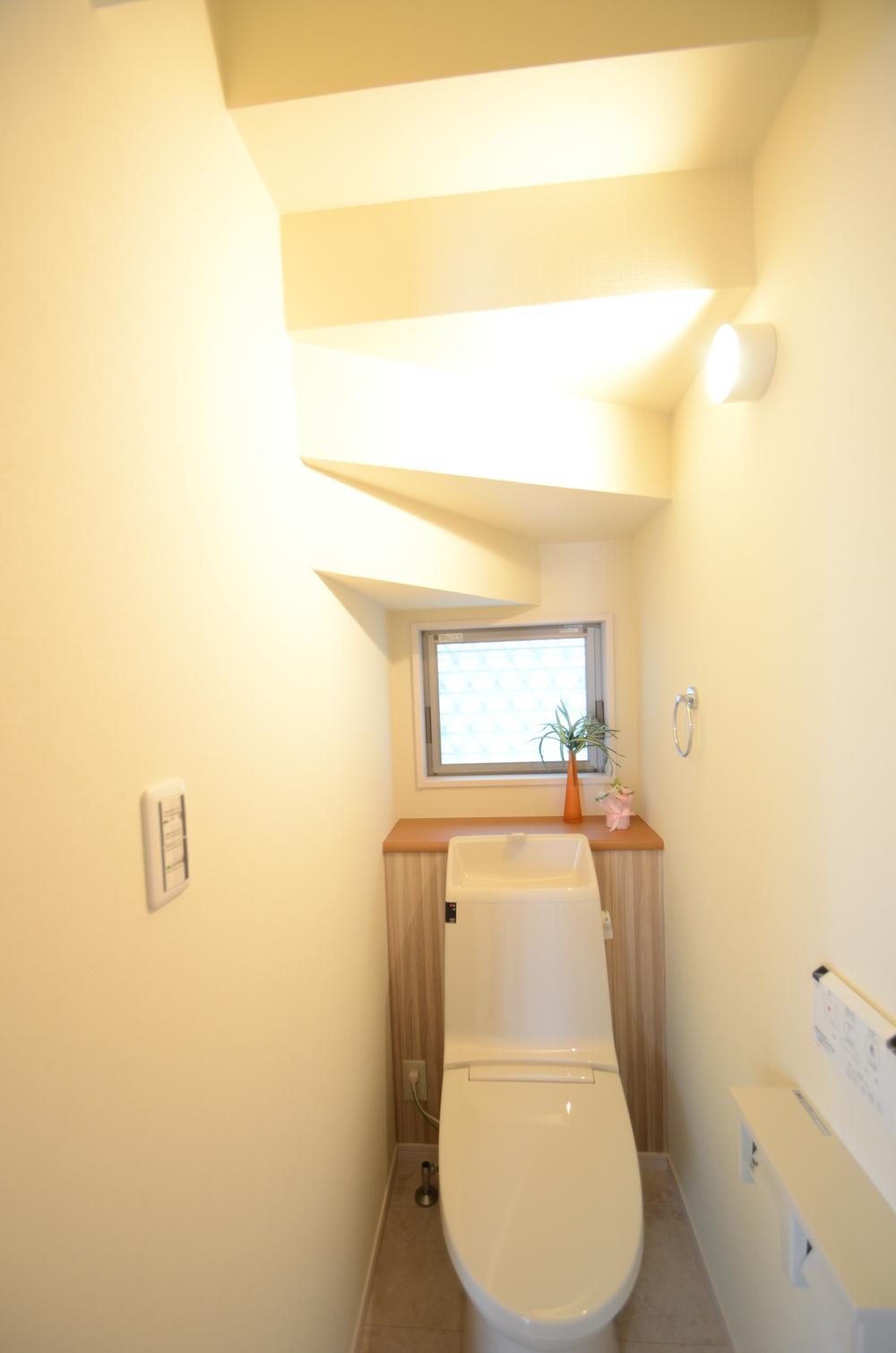 Toilet. There is a toilet under the stairs. Also devised that does not interfere with the path to the lavatory in the folding door of the door.