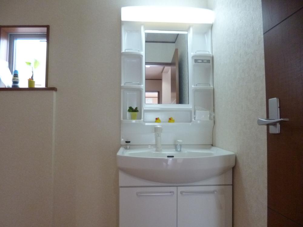 Wash basin, toilet. Shower Dresser! Bright washroom there is a small window!