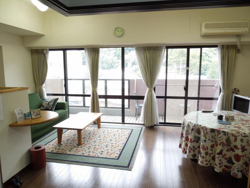 Living. It is a bright room with large windows.