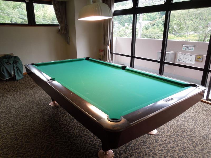 Other. Pool table is located two.