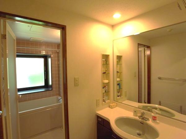 Wash basin, toilet. Powder room and, It is a bathroom. Also said that the corner room unique for there is a window in the bathroom