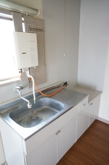 Kitchen. Sink also spacious with a water heater! With storage! 