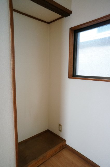 Other room space. There is a refrigerator space next to the kitchen