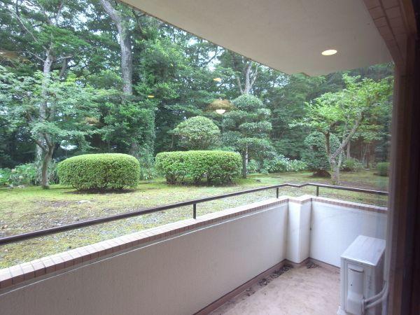 Balcony. You can see the pleasantly landscaped garden.