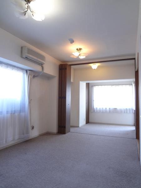 Living. The room is a corner room.