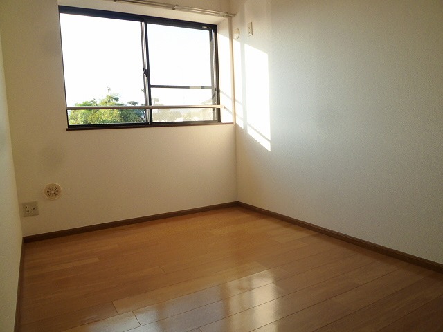 Other room space. It is bright and there windows in the room.