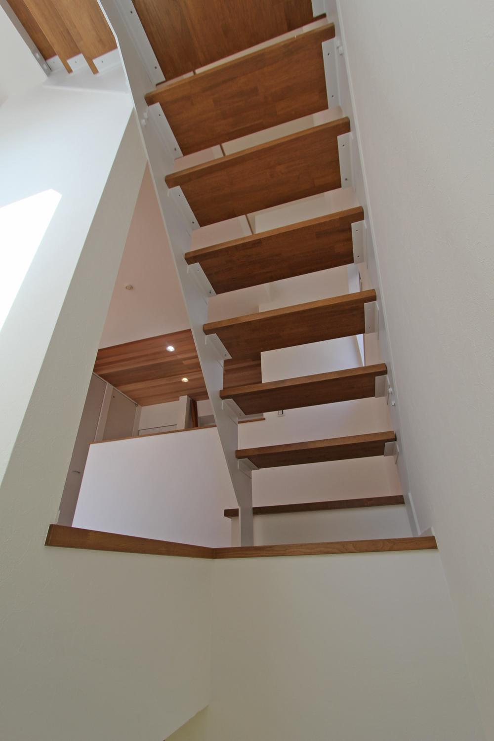 Model house photo. Approach to the loft Skeleton stairs Example of construction