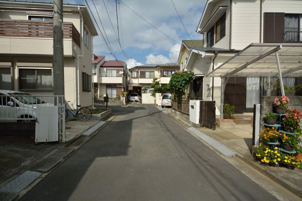 Local photos, including front road. Development subdivision in.  It is calm and clean streets. 