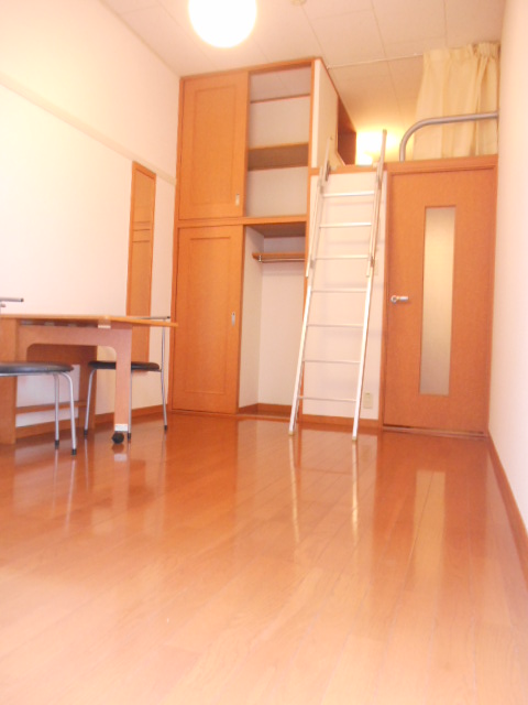 Living and room. Popular with loft Flooring is the floor. 
