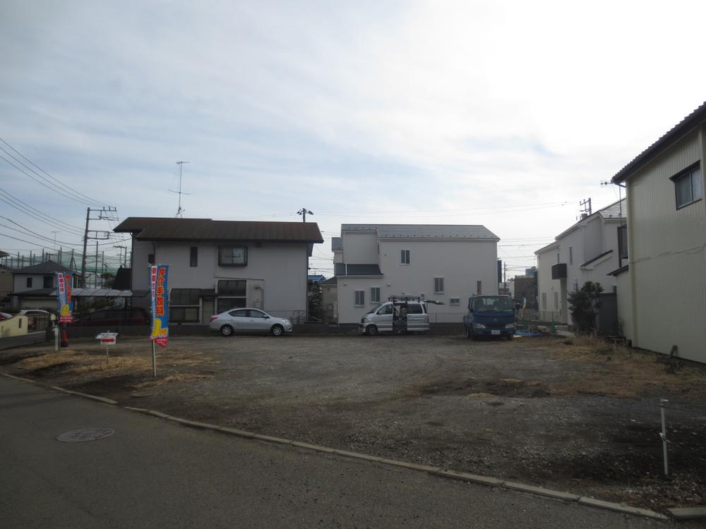 Local land photo. To rear, Finished ready-built are now visible.