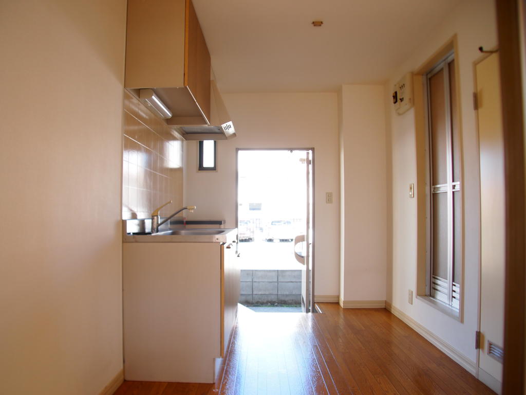 Kitchen. The left hand before the washing machine storage.