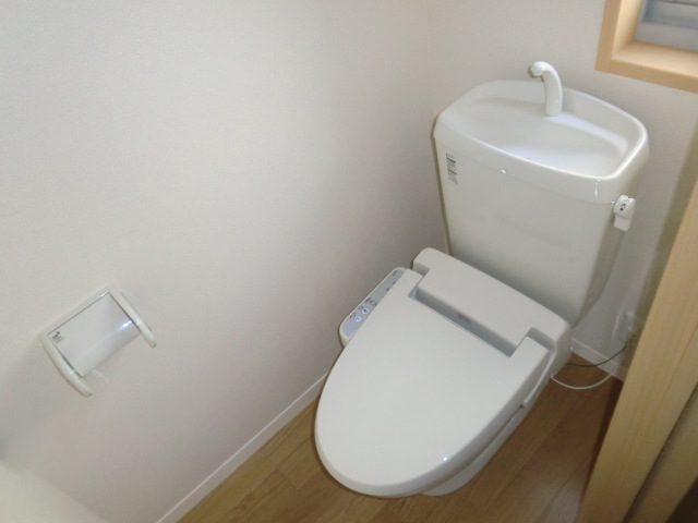 Toilet. Happy is with a bidet