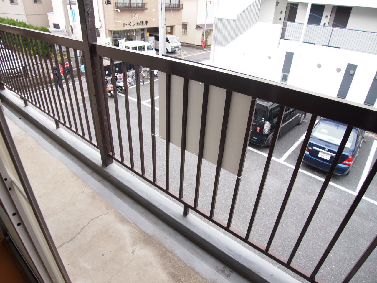 Balcony. There is a washing machine storage on the balcony. 