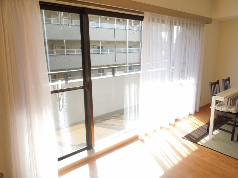 Living. Light enters a lot in the big four window.