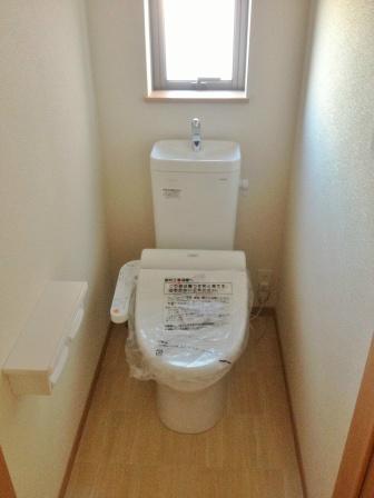 Toilet. Bright toilet there is a window!