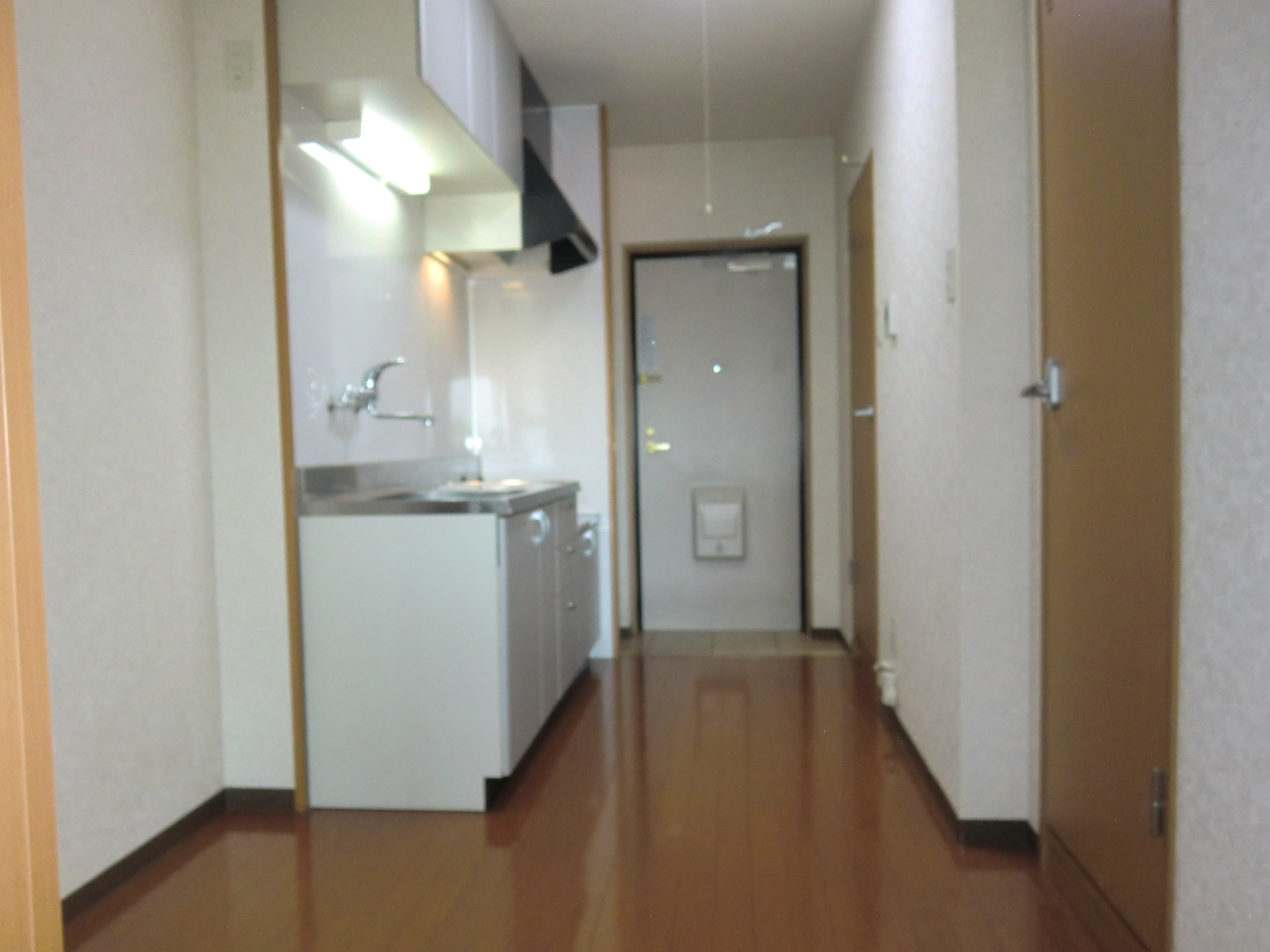 Kitchen. Also put the refrigerator and cupboards in the kitchen next to.