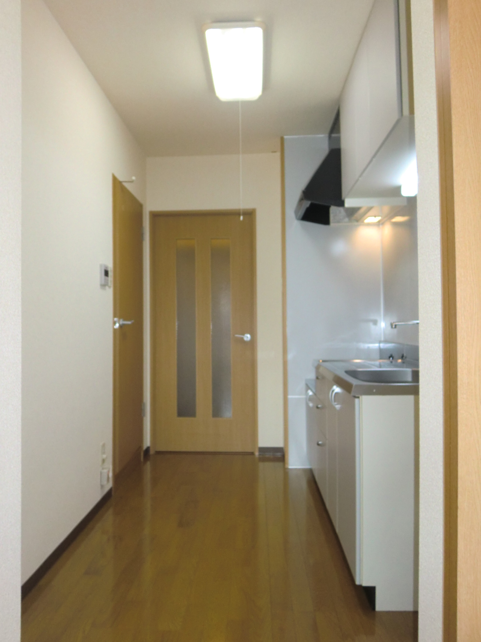 Kitchen. A refrigerator is put in the kitchen next to.