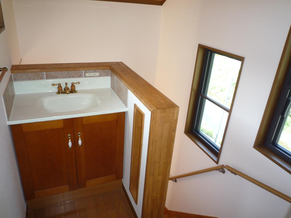 Wash basin, toilet. Wash basin have also on the second floor!