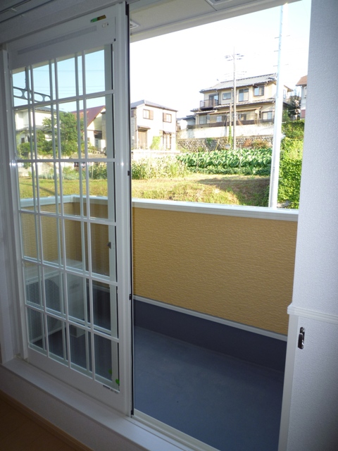 Balcony. And also a window out to the veranda, Cute.