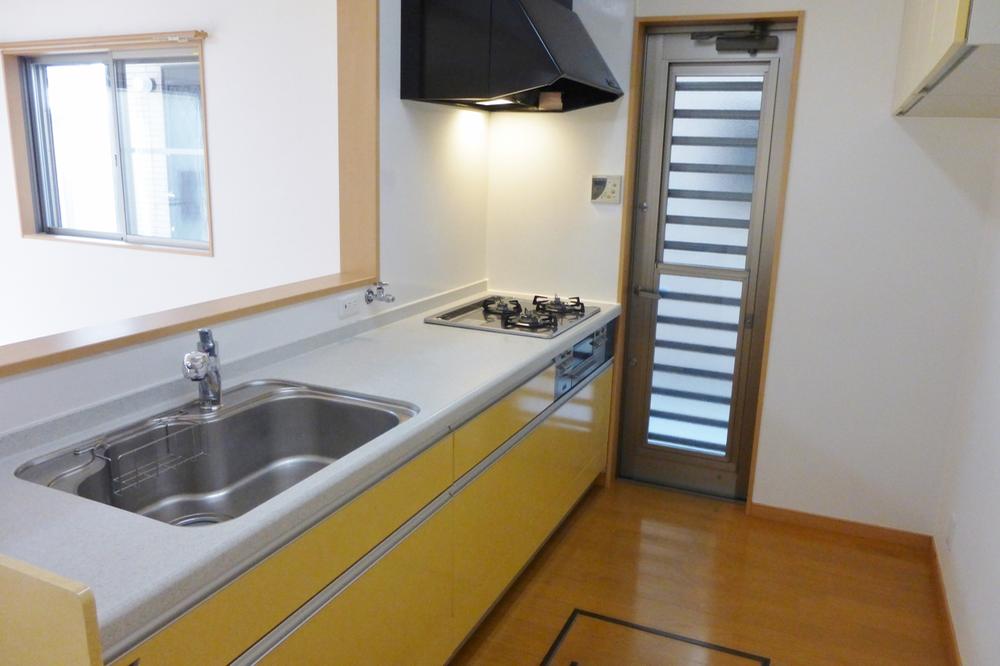 Kitchen. Three-necked stove + kitchen door there!