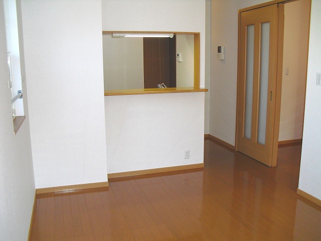 Living and room. It overlooks the indoor face-to-face kitchen