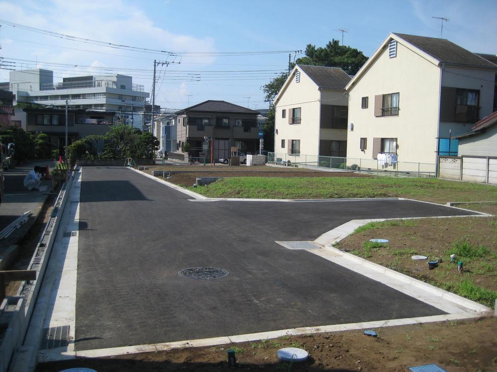 Local land photo. Sunny residential land in which the south side of the road