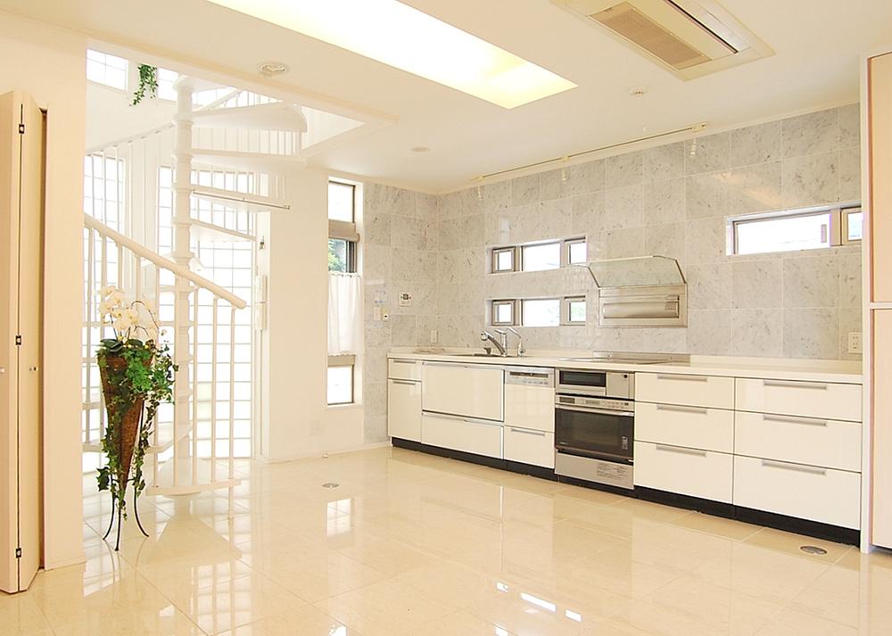 Living. Glass block that is designed to circle us deliver a soft light in the room. Spiral staircase leading to the second floor enhances the sense of openness and design, It has become a room of accent.