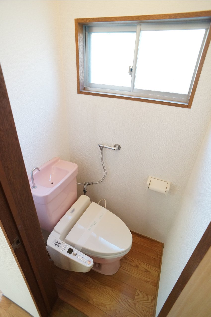 Toilet. Small window is a point. It is with warm water washing toilet seat. 