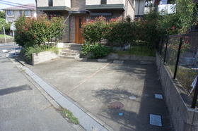 Building appearance. Parking lot
