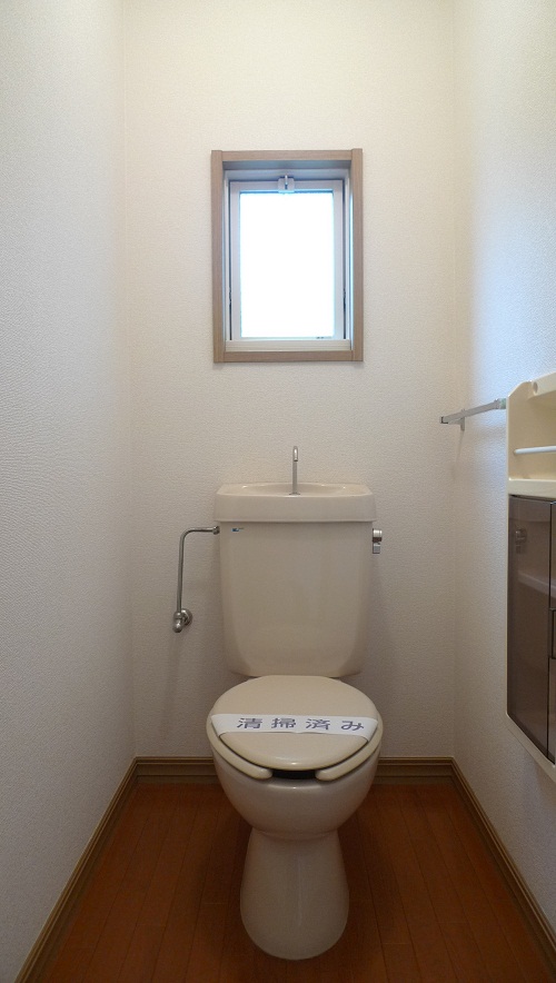 Toilet. There is a window.